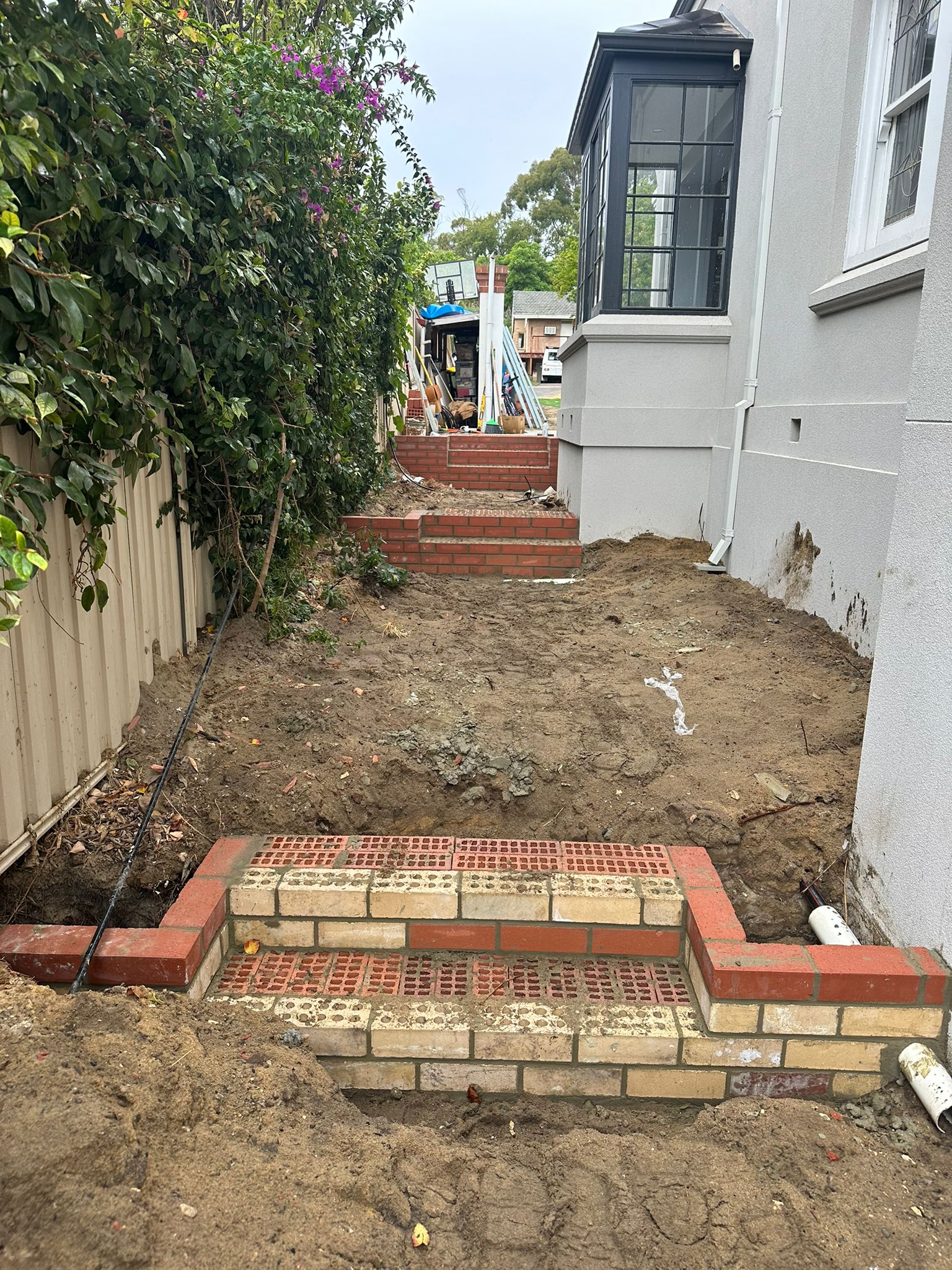 Retaining mass brick stairs leading up to the property — Nedlands